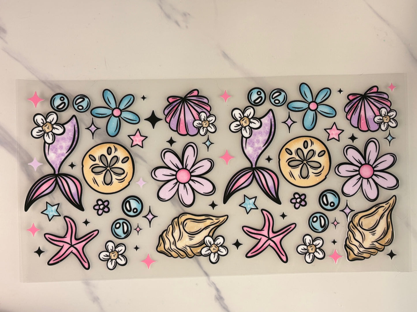 Mermaid, fins, and seashells