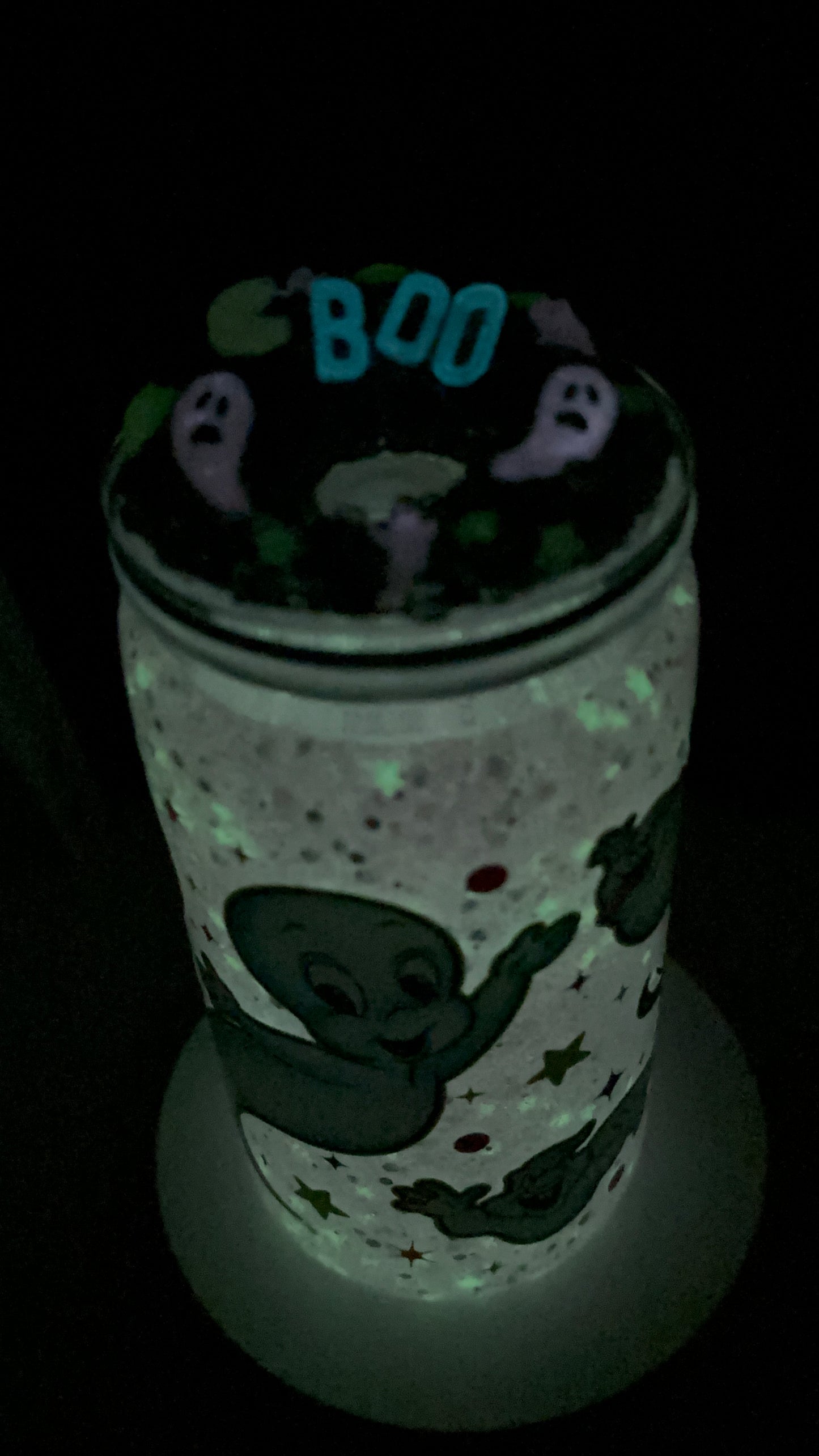 Cute little friendly ghost snow globe