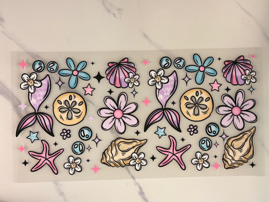 Mermaid, fins, and seashells