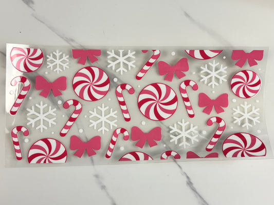 Pink candy, canes, and snowflakes