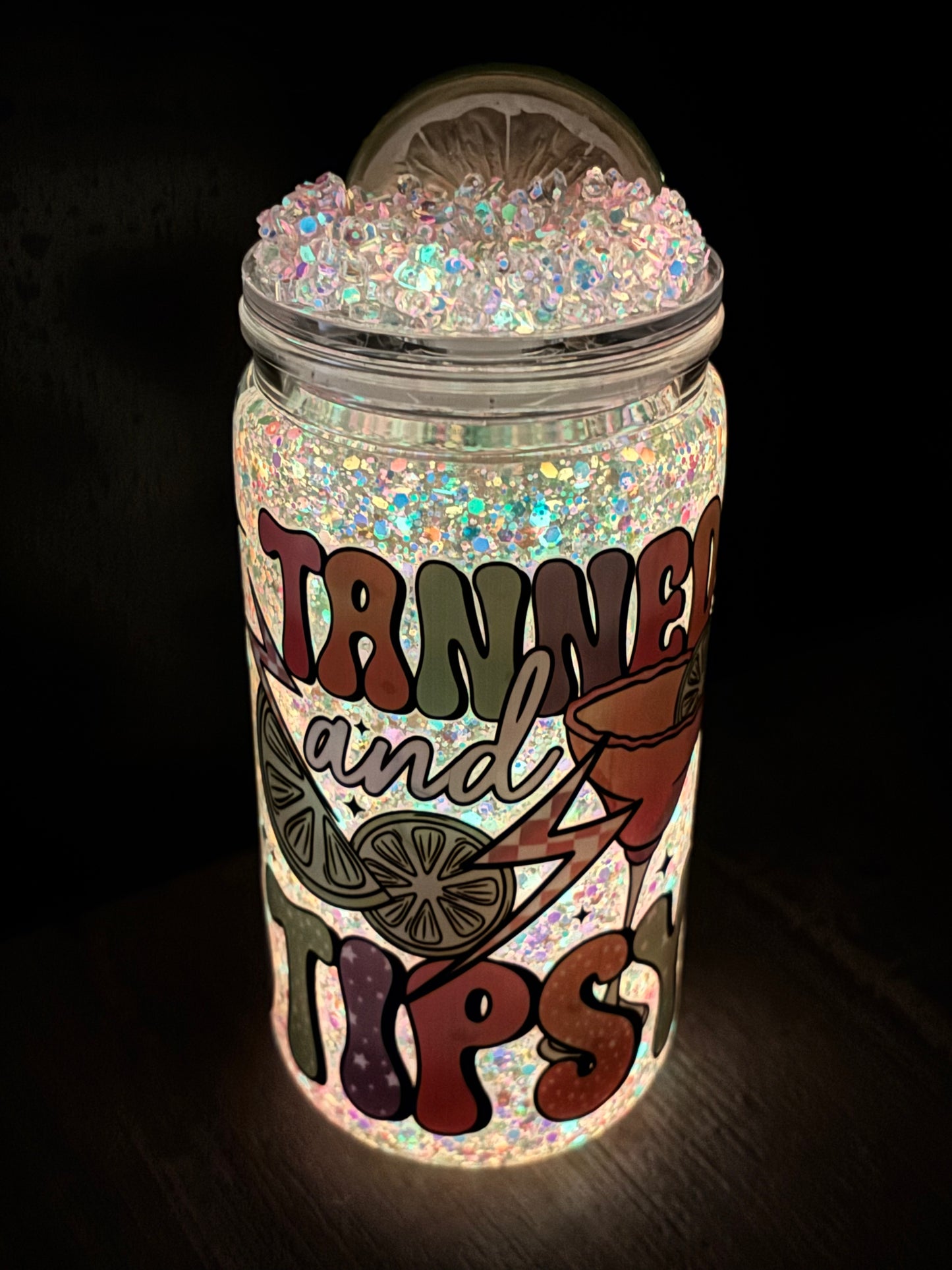 Tan and tipsy glowing snow globe