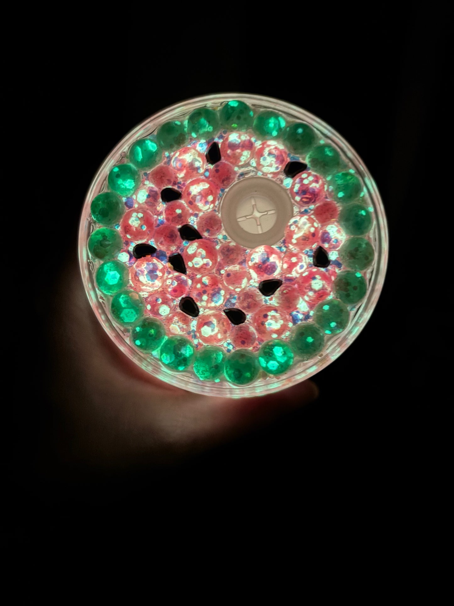 Glowing watermelon snow globe