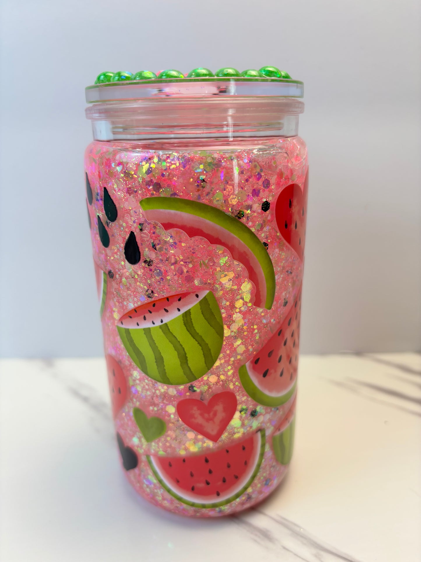 Glowing watermelon snow globe