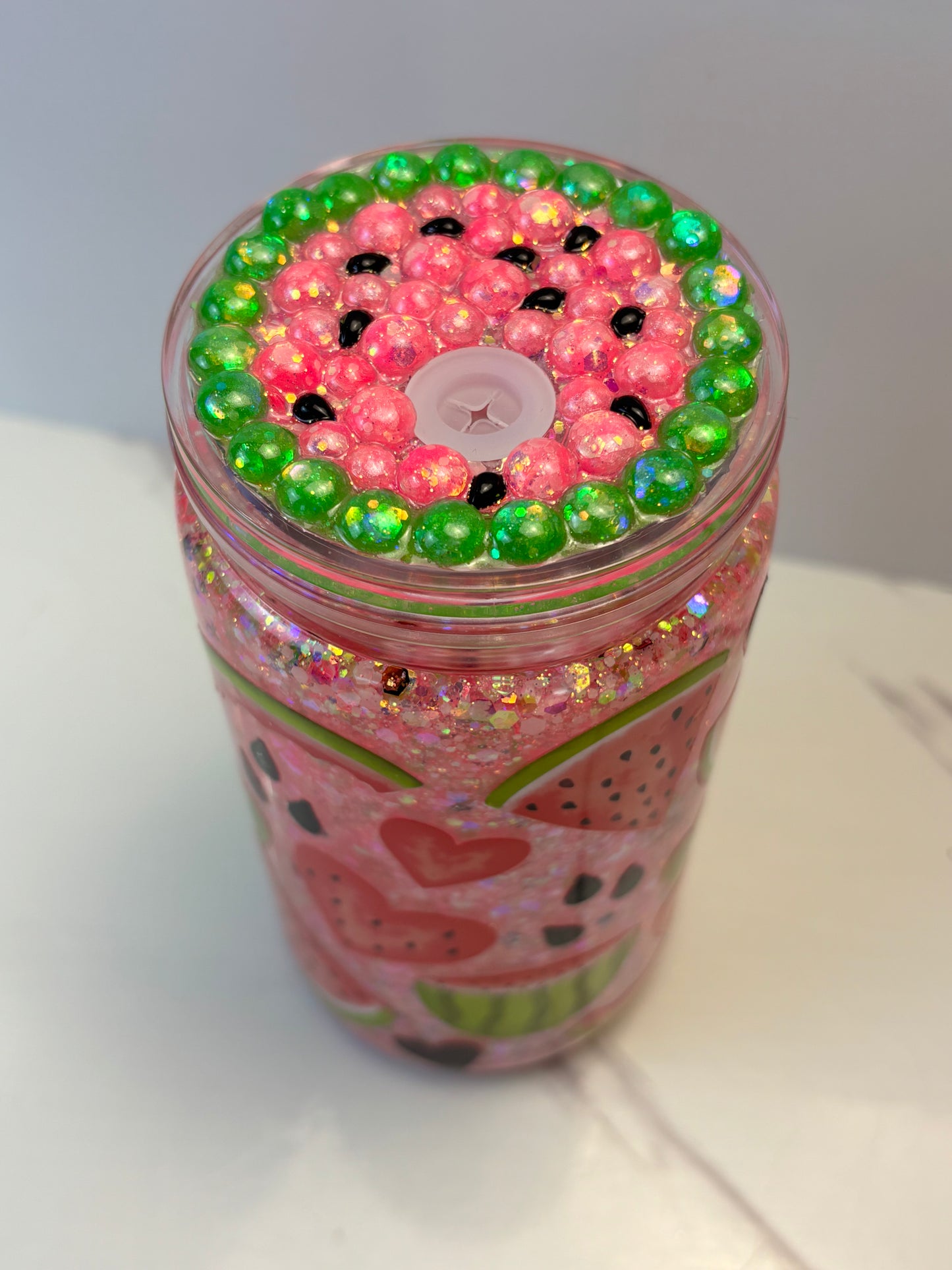 Glowing watermelon snow globe