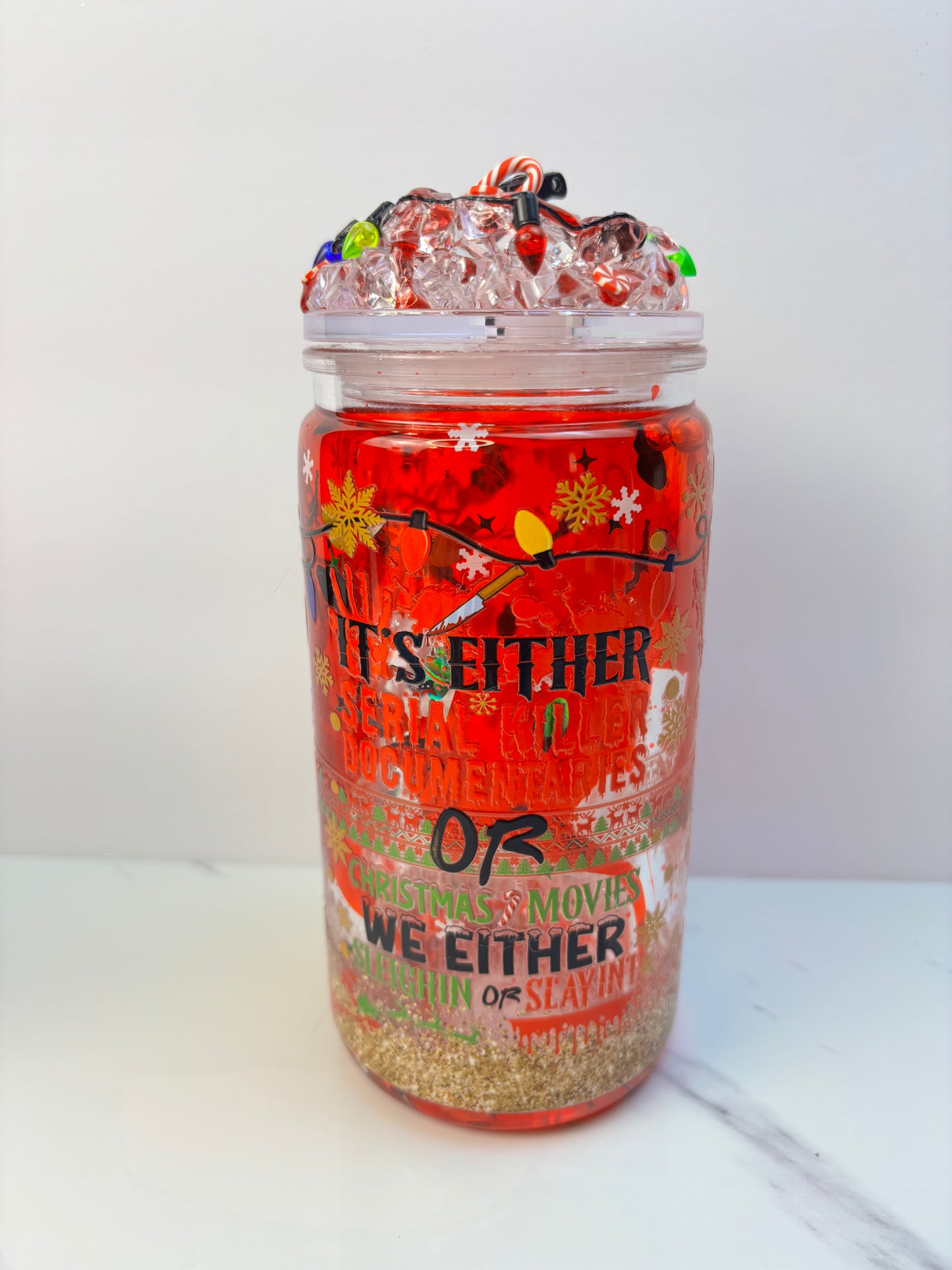 2 styles-Slaying or sleighing snow globe cup.