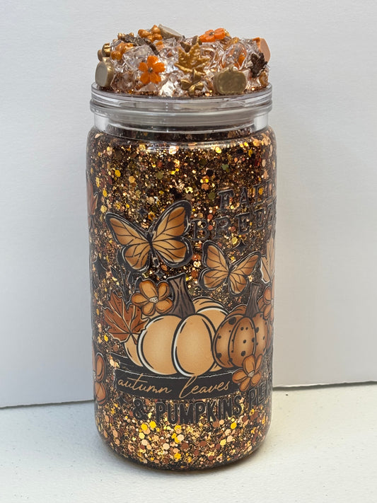 Pumpkins, leaves, and a fall breeze snow globe cup