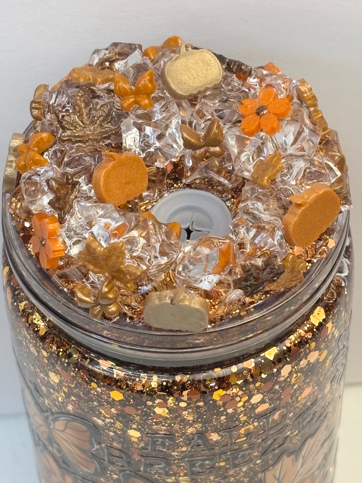 Pumpkins, leaves, and a fall breeze snow globe cup