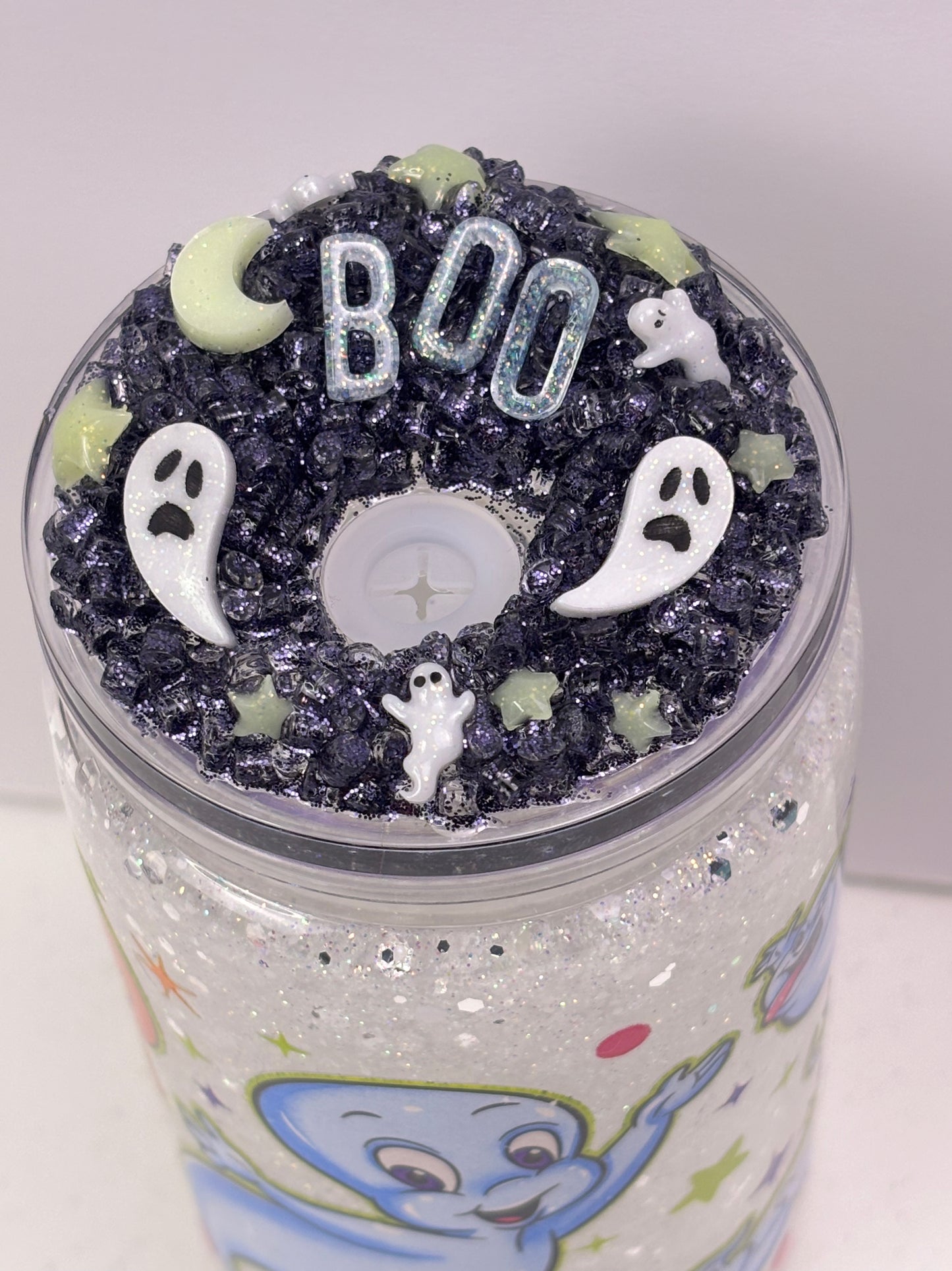 Cute little friendly ghost snow globe