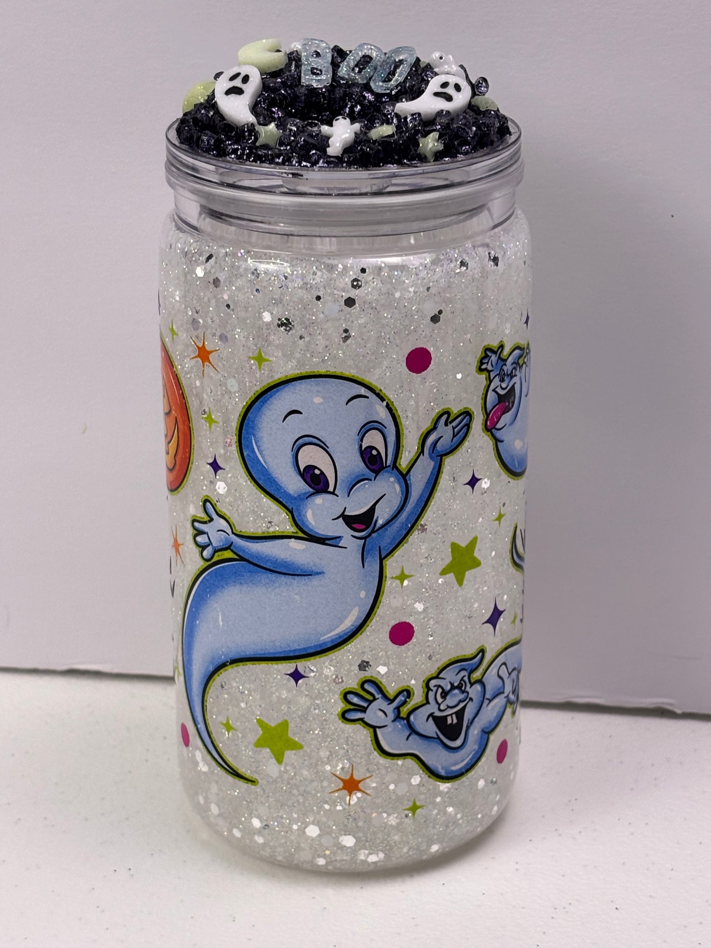 Cute little friendly ghost snow globe