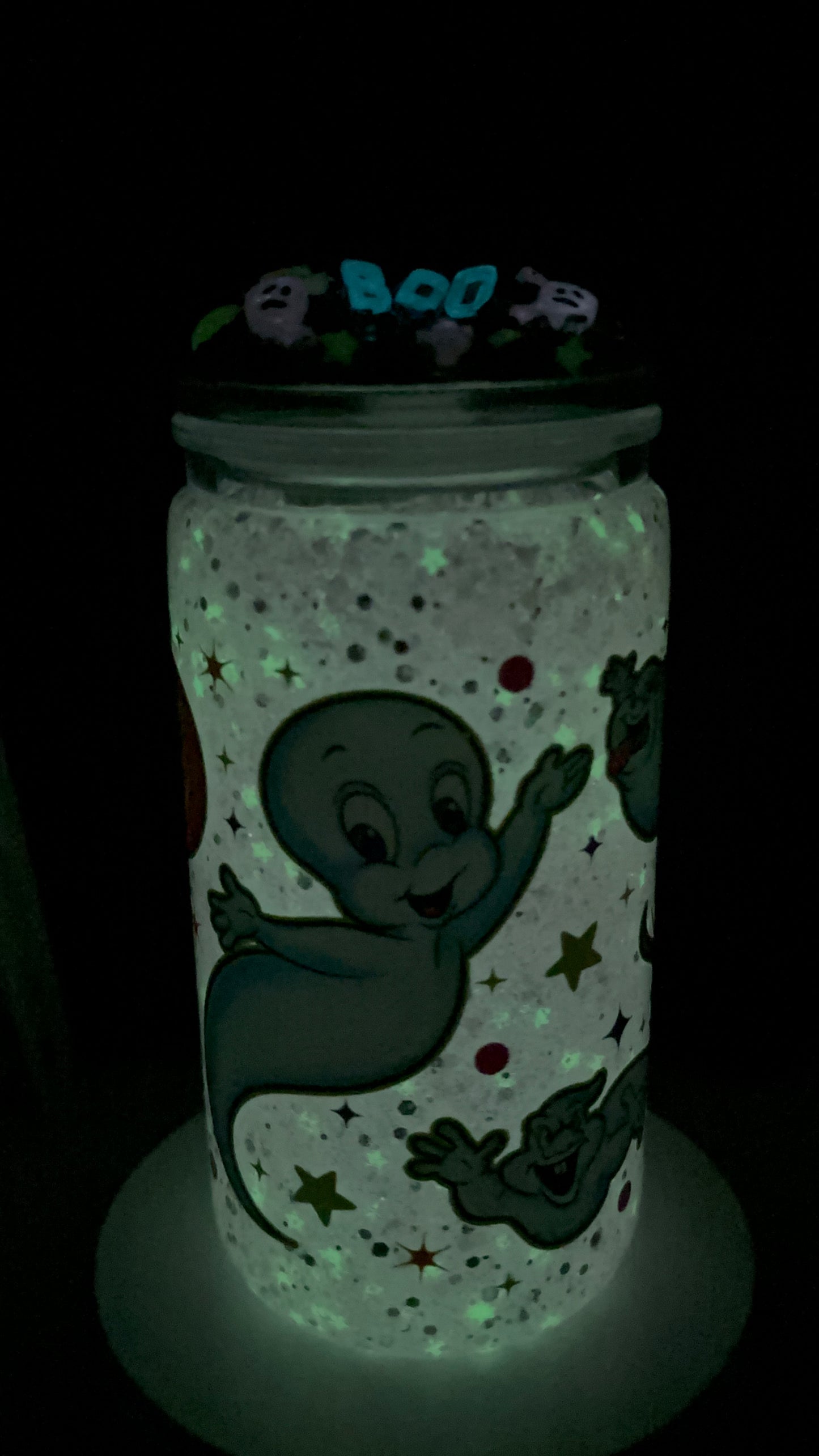 Cute little friendly ghost snow globe